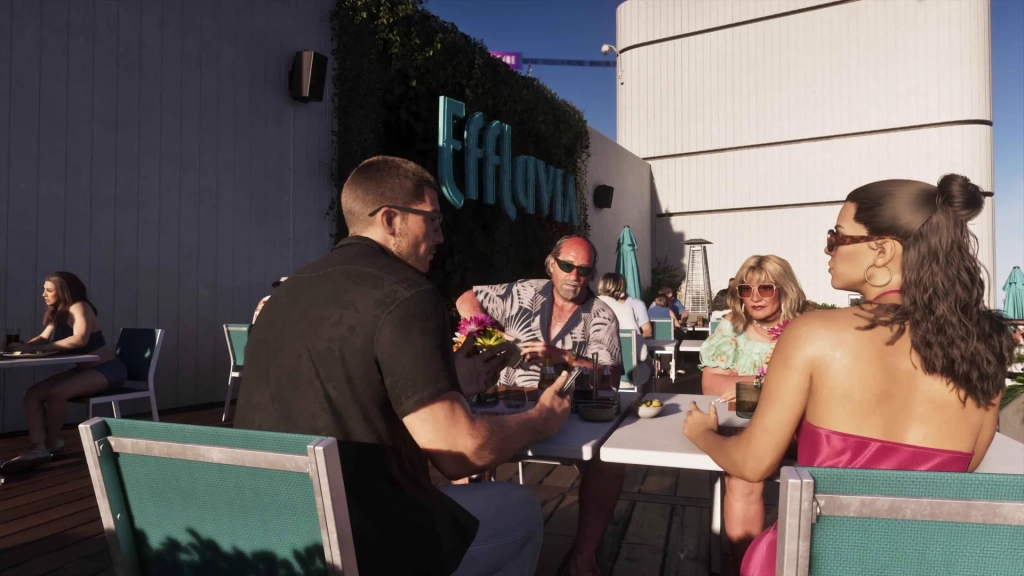 Jason et Lucia sont assis à une table avec un couple plus âgé en rooftop